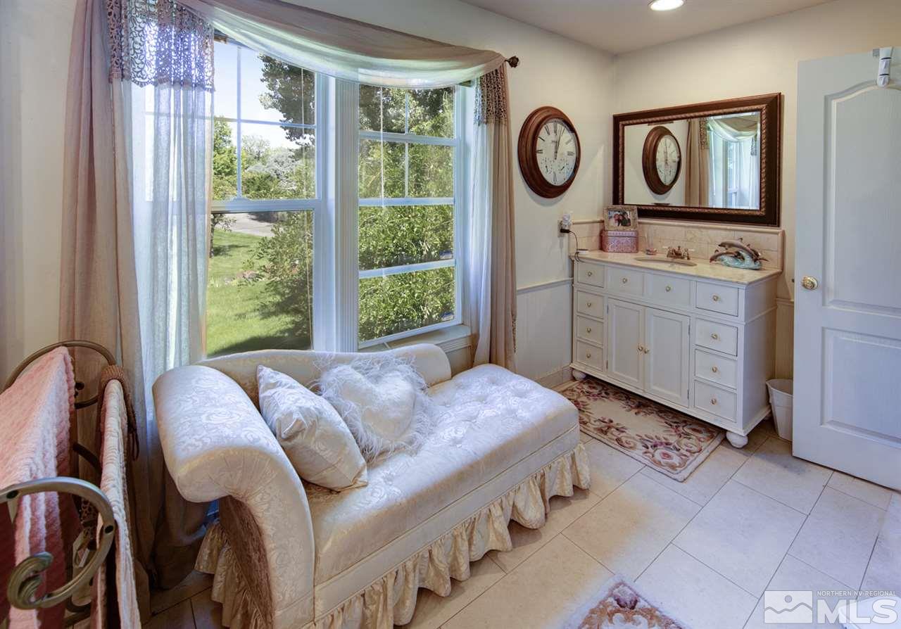5721 Rivers Edge Drive Fallon, NV 89406 - Photo 11 of 17 a bedroom with a bed and a table