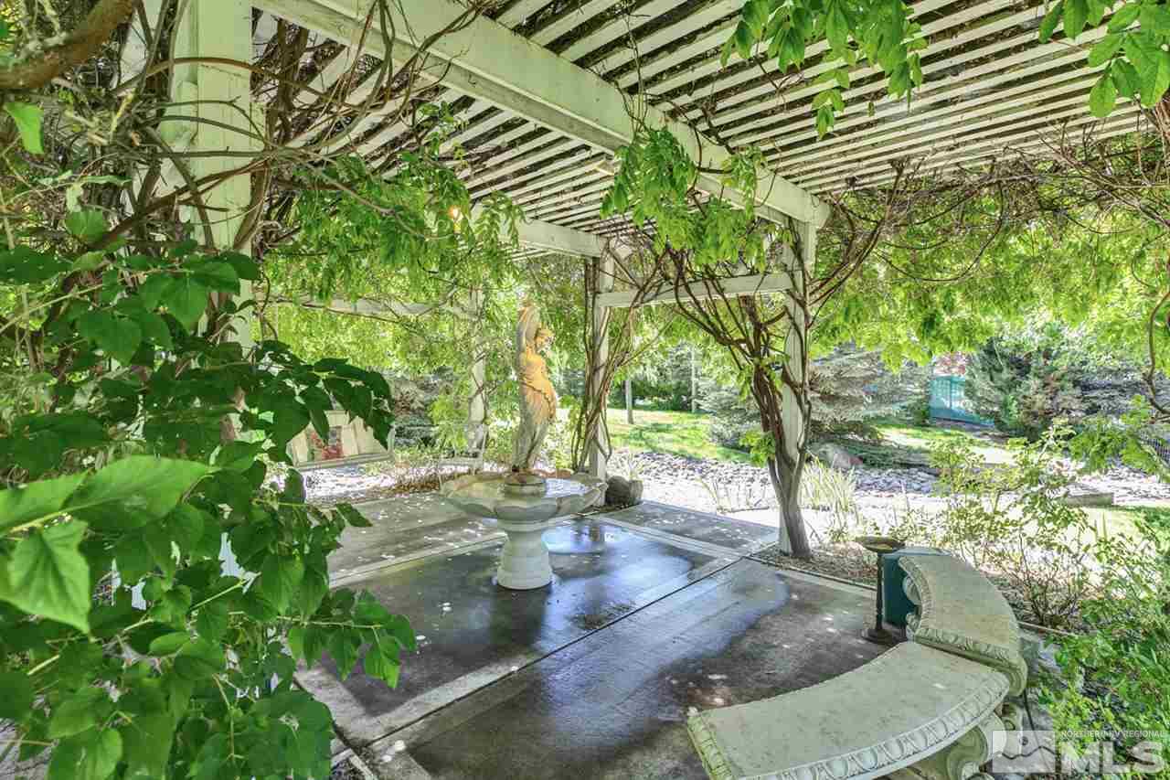 5721 Rivers Edge Drive Fallon, NV 89406 - Photo 14 of 17 a backyard of a house with table and chairs