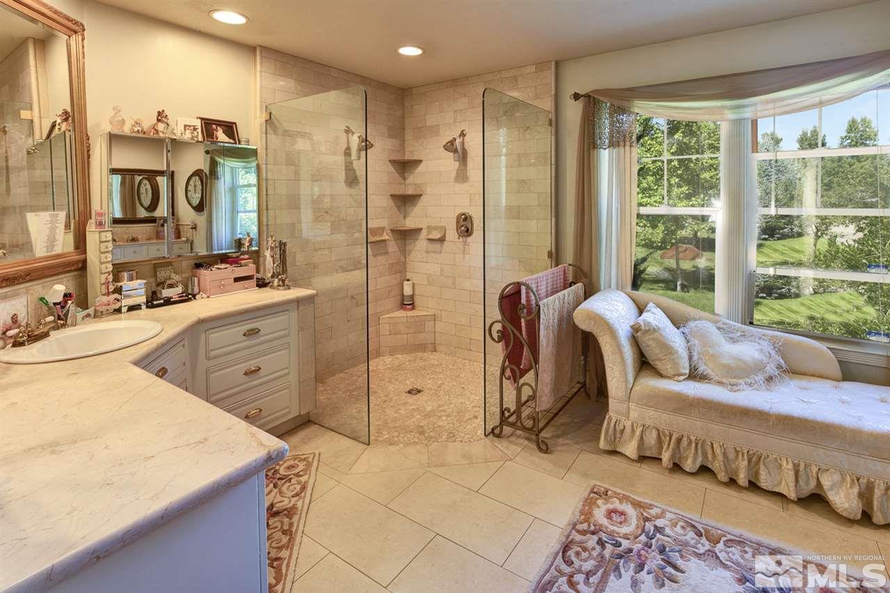 5721 Rivers Edge Drive Fallon, NV 89406 - Photo 9 of 17 a large bedroom with a large bed and a dresser