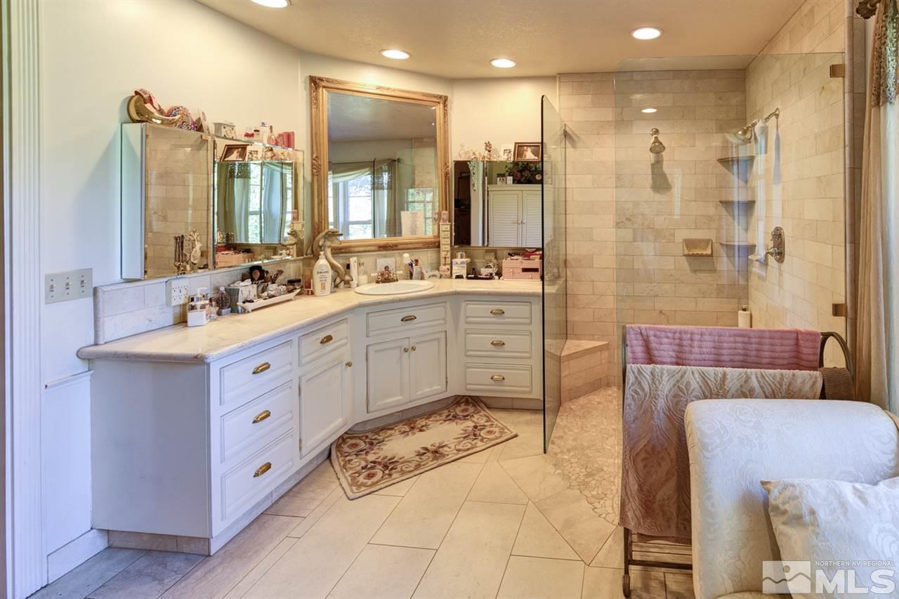 5721 Rivers Edge Drive Fallon, NV 89406 - Photo 10 of 17 a spacious bathroom with a double vanity sink mirror and double