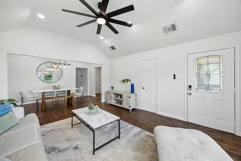 a living room with furniture and a window