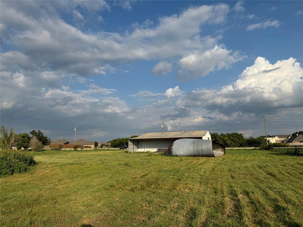 13625 Reeder Road Forney, TX 75126 - Photo 18 of 18 a backyard of a house with lots of green space
