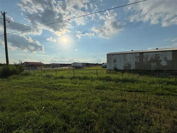 a view of an house with a big yard