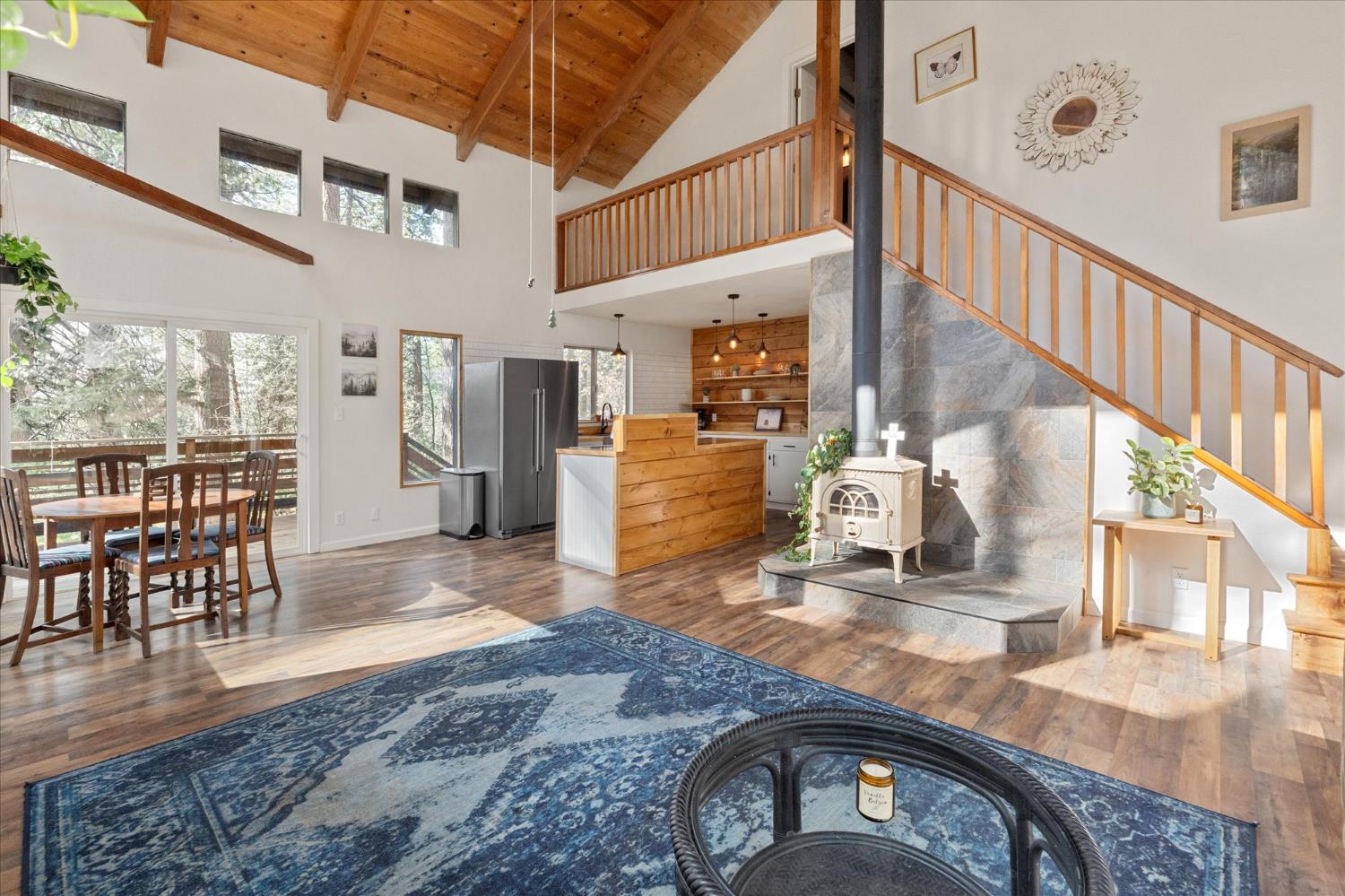 210 David Lee Road Arnold, CA 95223 - Photo 1 of 37 a view of a livingroom with furniture wooden floor and a kitchen view