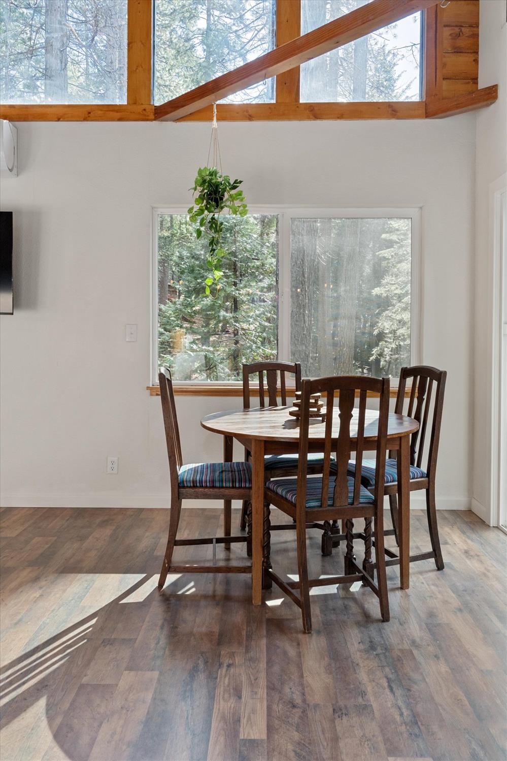 210 David Lee Road Arnold, CA 95223 - Photo 13 of 37 a dining room with furniture and wooden floor
