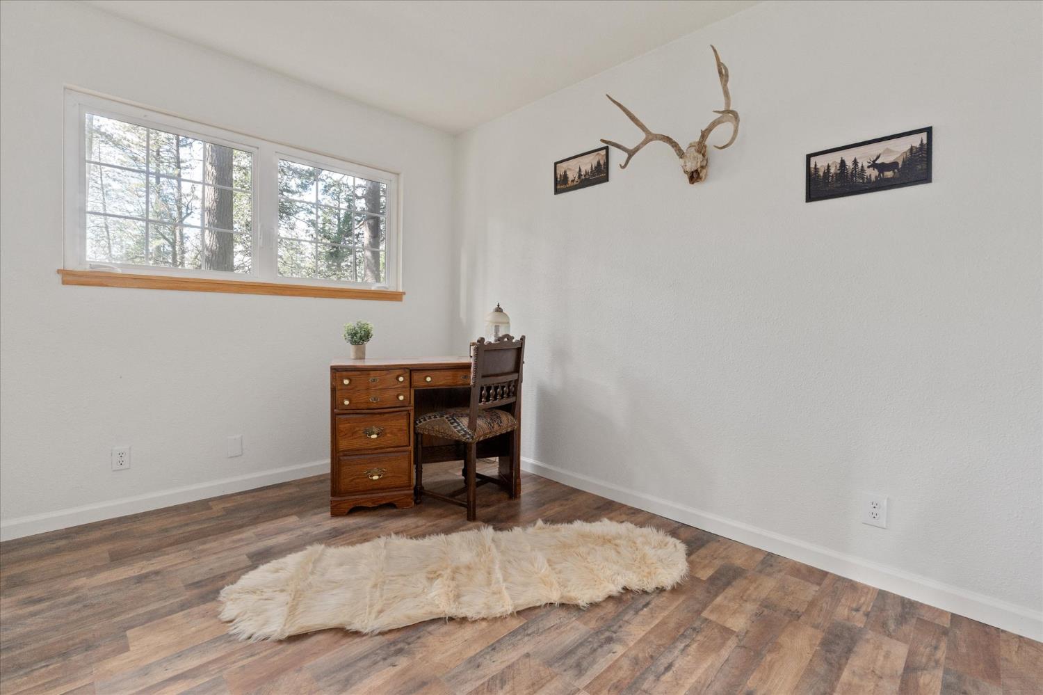 210 David Lee Road Arnold, CA 95223 - Photo 20 of 37 a view of a workspace with furniture and a window