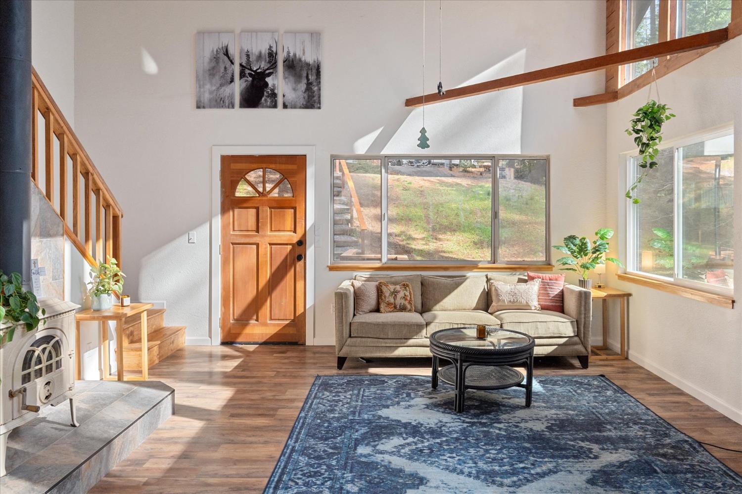 210 David Lee Road Arnold, CA 95223 - Photo 9 of 37 a living room with furniture and a floor to ceiling window
