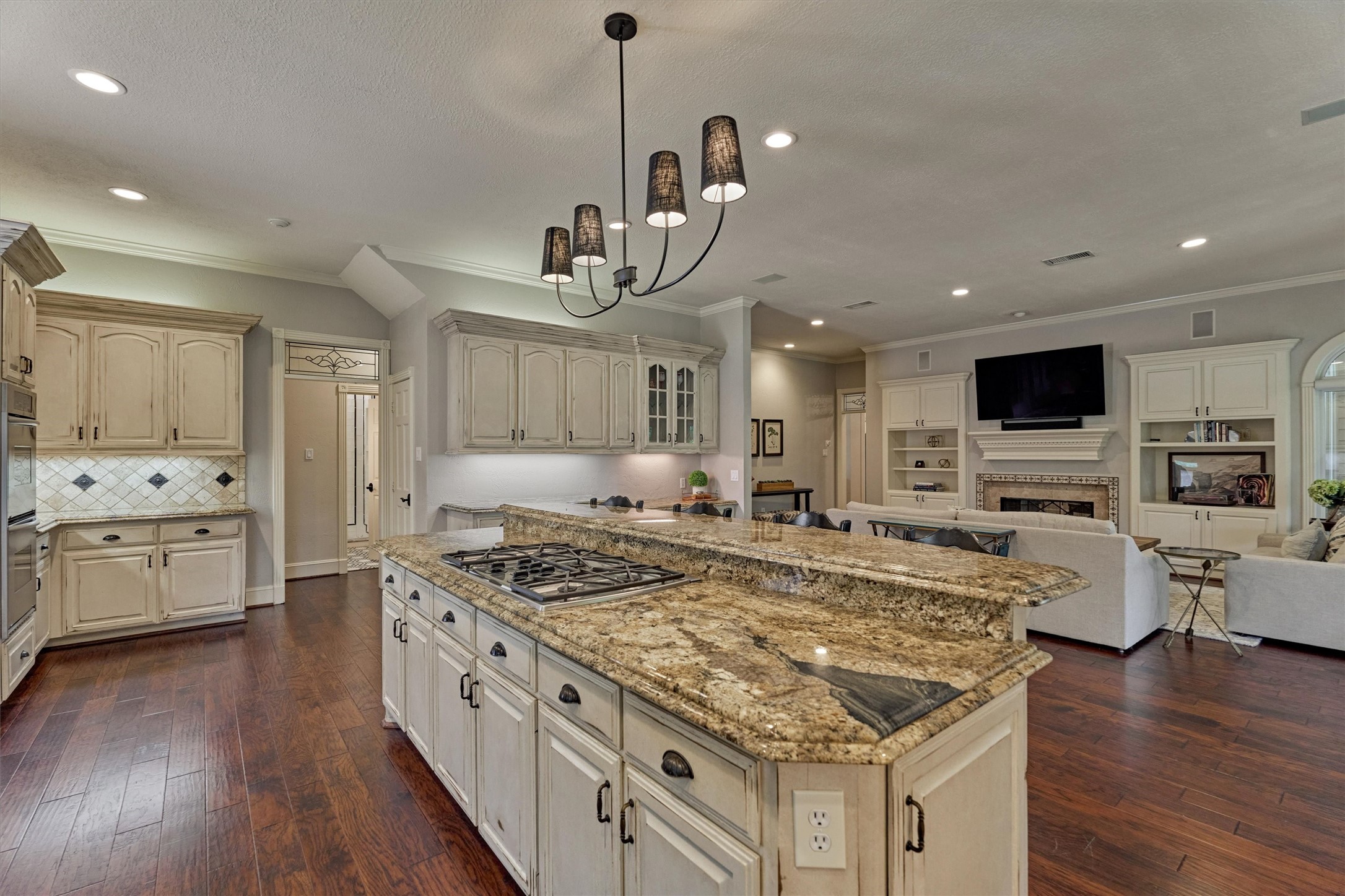 18 Treevine Court The Woodlands, TX 77381 - Photo 17 of 50 Enjoy seamless flow and connection between the kitchen and den, making this space incredibly inviting and spacious.