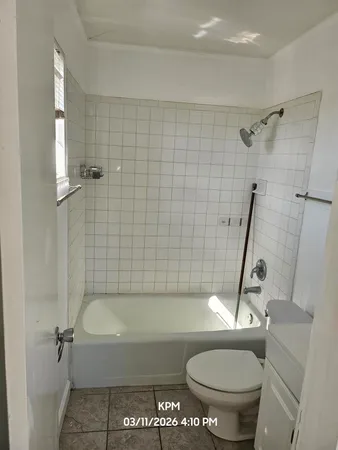 a bathroom with a sink a toilet and a bathtub