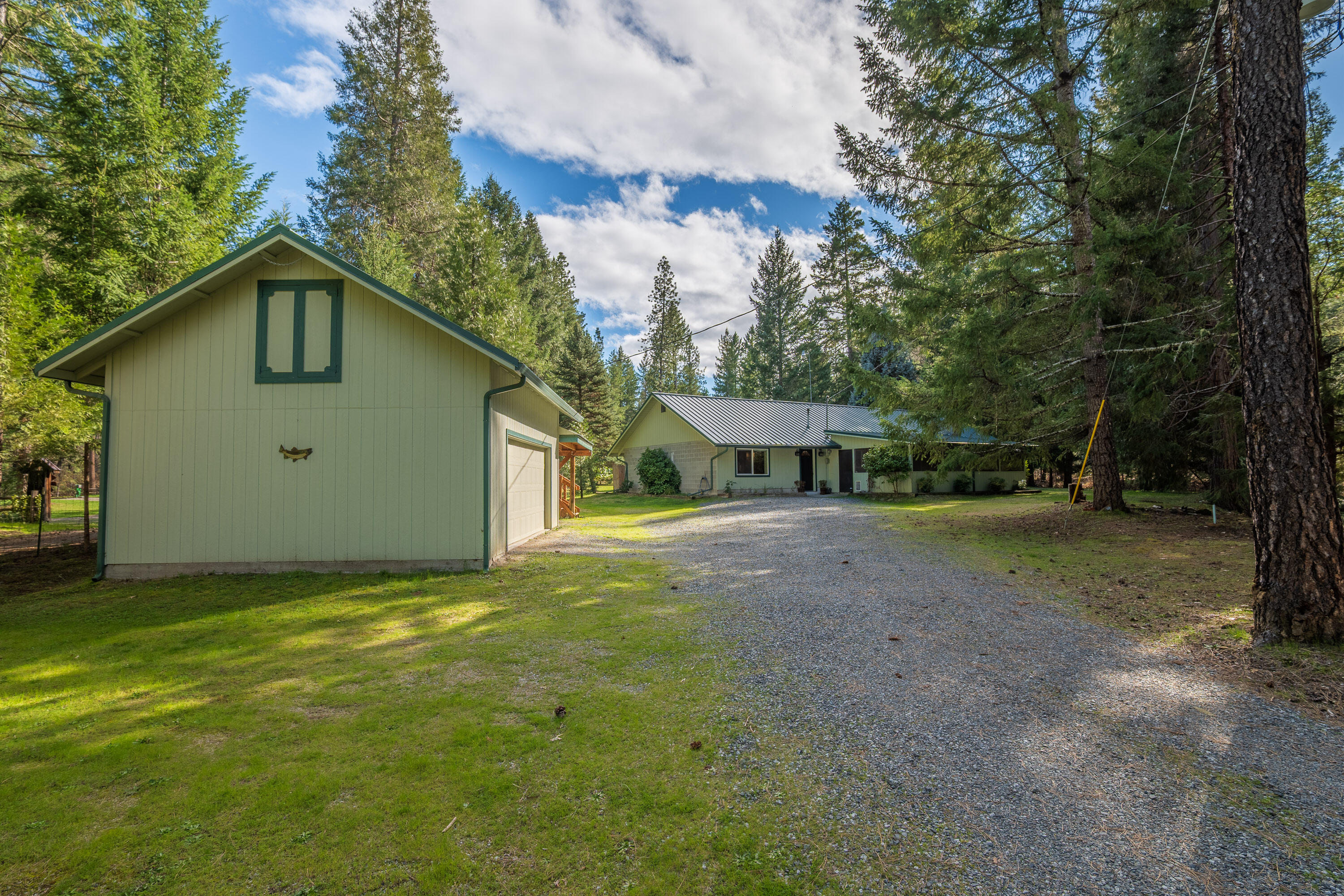 244 Riessen Road Grants Pass, OR 97526 - Photo 3 of 52 a view of a house with backyard and tree