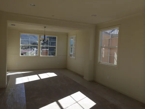 a view of an empty room and window