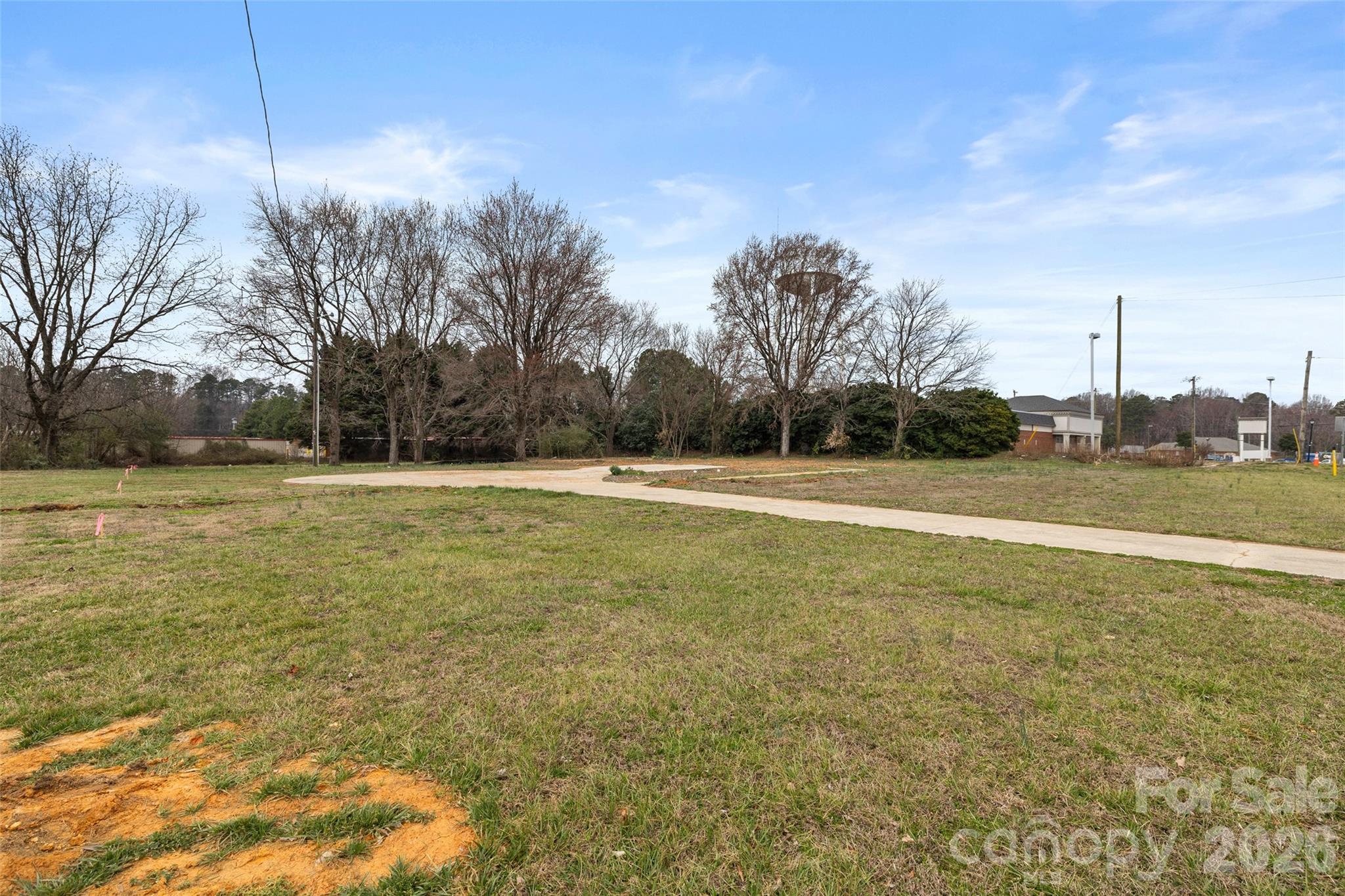 4324 Old Monroe Road Indian Trail, NC 28079 - Photo 4 of 8 a view of a field with trees in the background