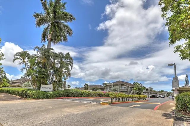 a view of a street with a building in the background