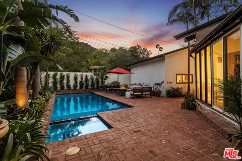 a view of a backyard with a patio