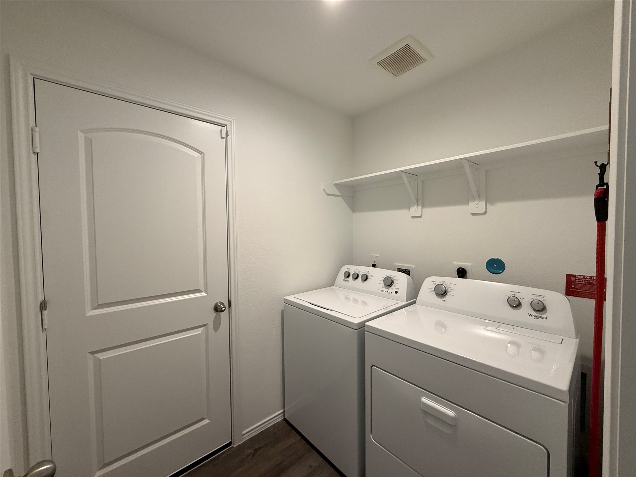 5607 Redstone Gardens Drive Spring, TX 77373 - Photo 11 of 13 a utility room with dryer and washer