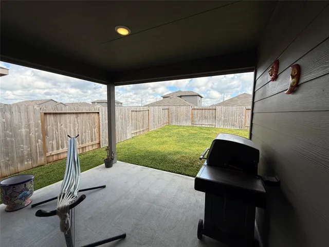 a view of backyard with trampoline