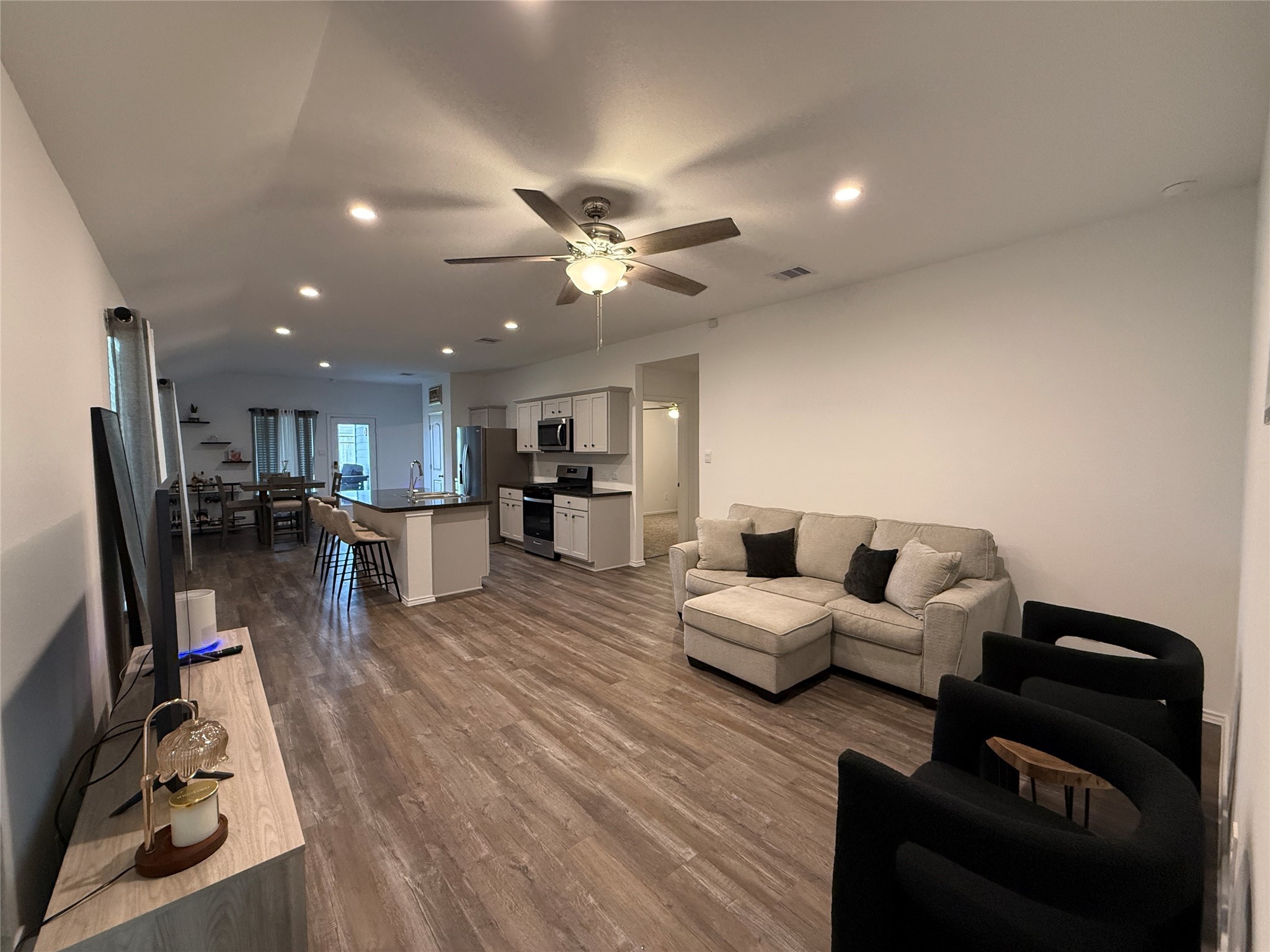 5607 Redstone Gardens Drive Spring, TX 77373 - Photo 2 of 13 a living room with furniture and kitchen view