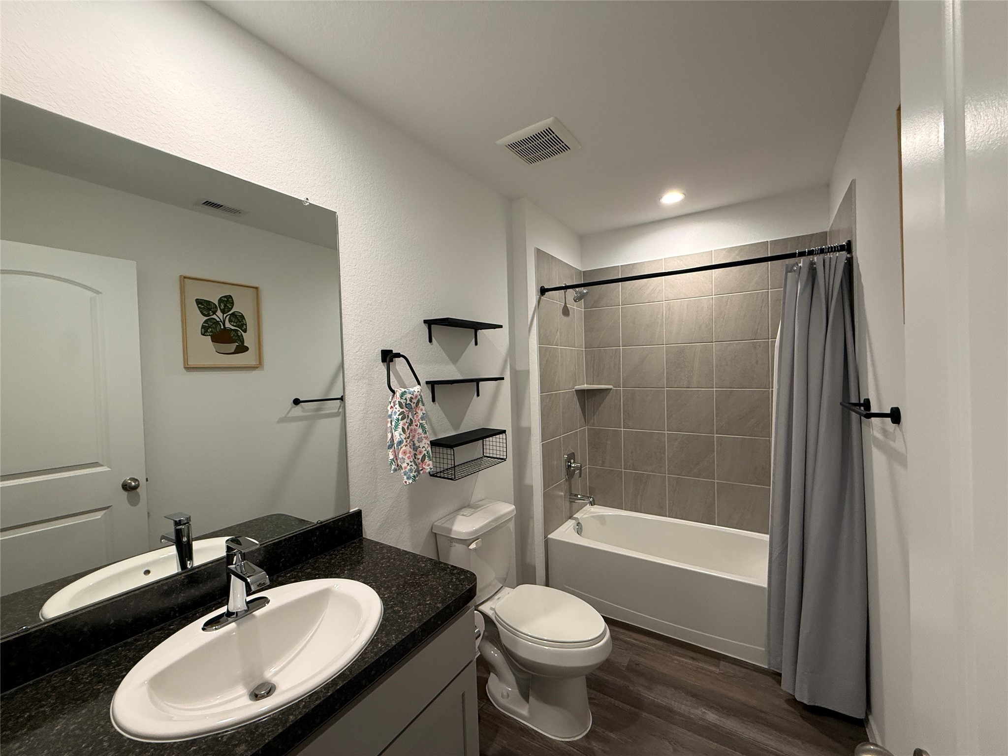 5607 Redstone Gardens Drive Spring, TX 77373 - Photo 10 of 13 a bathroom with a sink toilet a mirror and shower