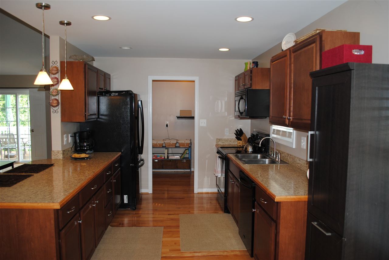 155 Chapel Road Ruckersville, VA 22968 - Photo 8 of 39 a kitchen with stainless steel appliances a sink stove and refrigerator