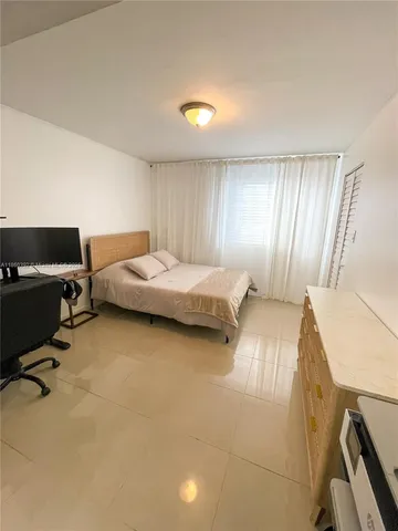 a bedroom with a bed and furniture