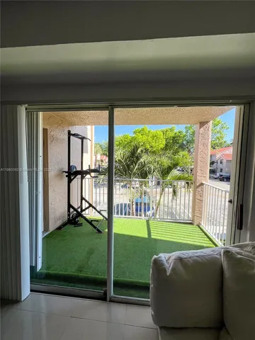 a living room with garden area and furniture