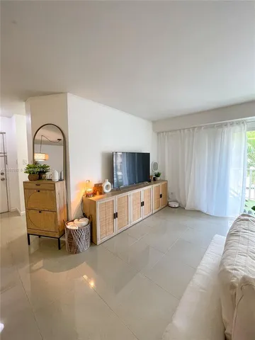 a view of a livingroom with furniture and windows