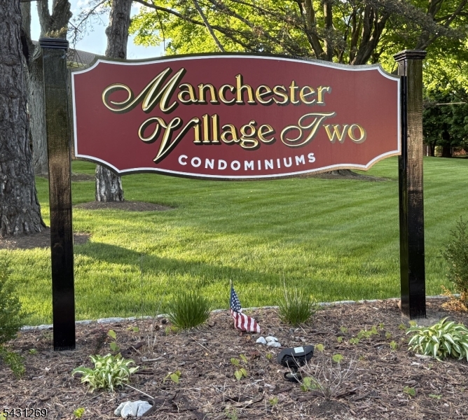 1241 Valley Road, Unit 1241 Wayne, NJ 07470 - Photo 1 of 12 a sign that is sitting on a brick wall