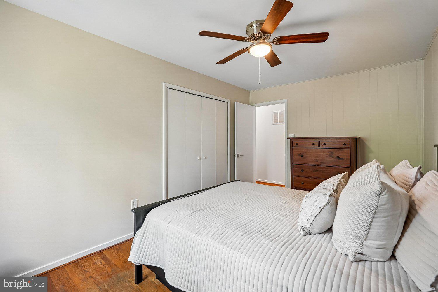 11110 Forest Edge Drive Reston, VA 20190 - Photo 24 of 46 Serene bedroom with warm wooden accents.