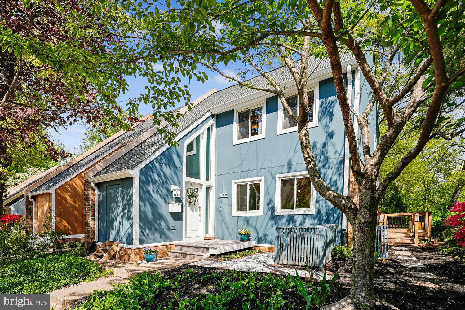 11110 Forest Edge Drive Reston, VA 20190 - Photo 3 of 46 Charming blue home nestled in lush greenery.