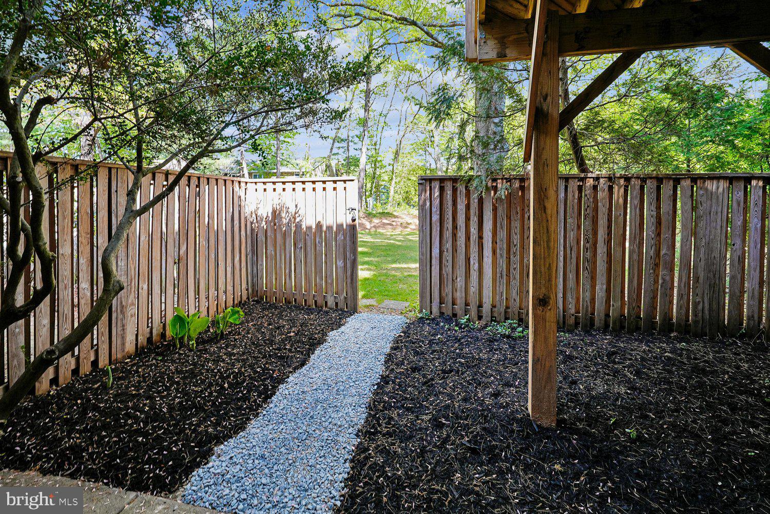 11110 Forest Edge Drive Reston, VA 20190 - Photo 35 of 46 Serene garden path to nature's embrace.