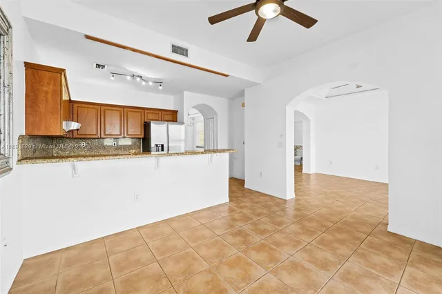 a view of a kitchen with a sink and cabinets
