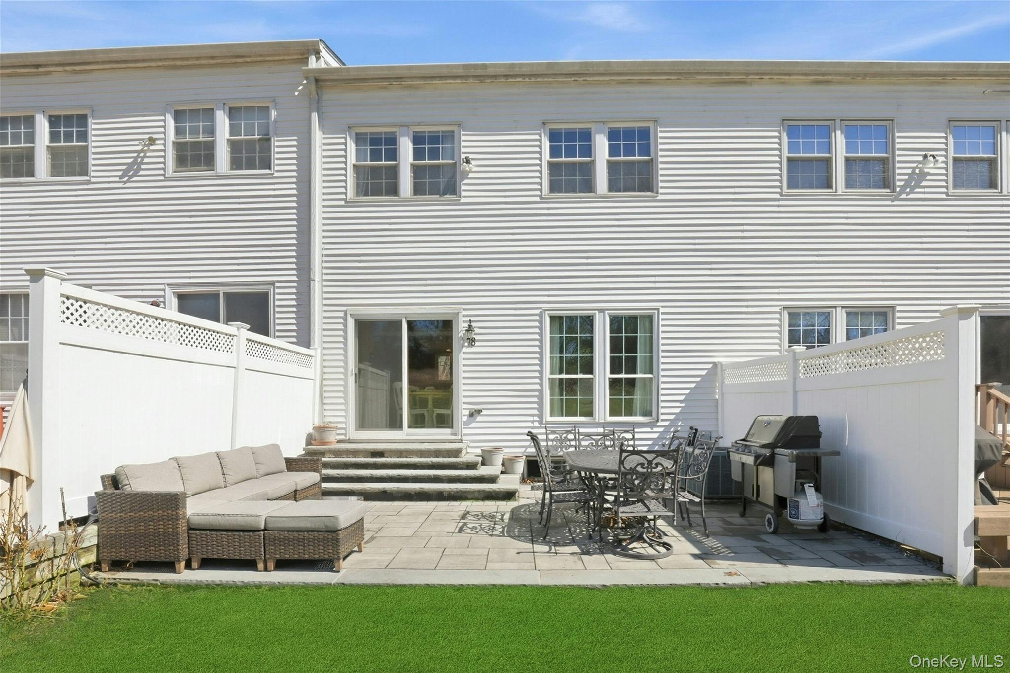 78 Hidden Ridge Drive Syosset, NY 11791 - Photo 19 of 21 a view of backyard of house with outdoor seating