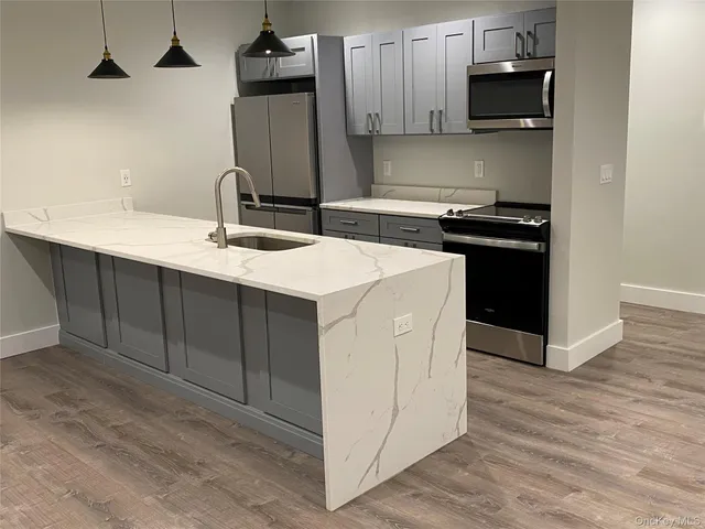 a kitchen with a sink and cabinets