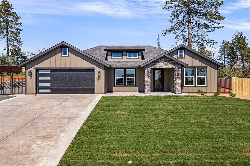 a front view of a house with a garden