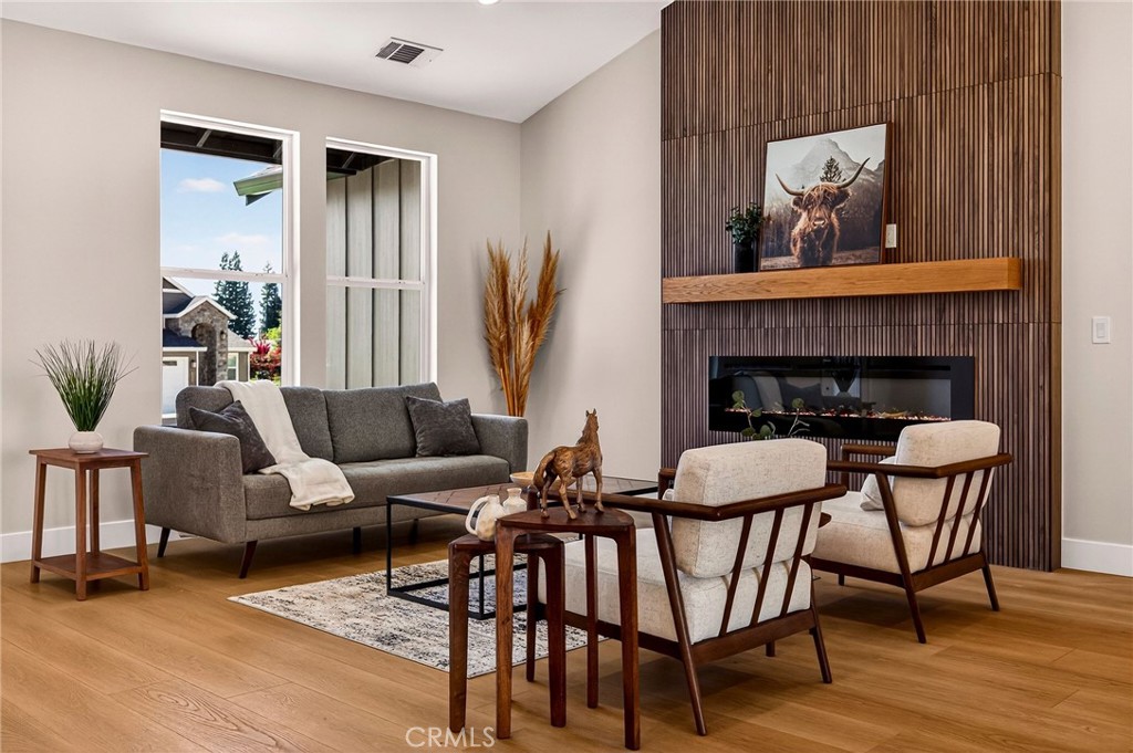 1528 Forest Paradise, CA 95969 - Photo 14 of 49 a living room with furniture and a fireplace