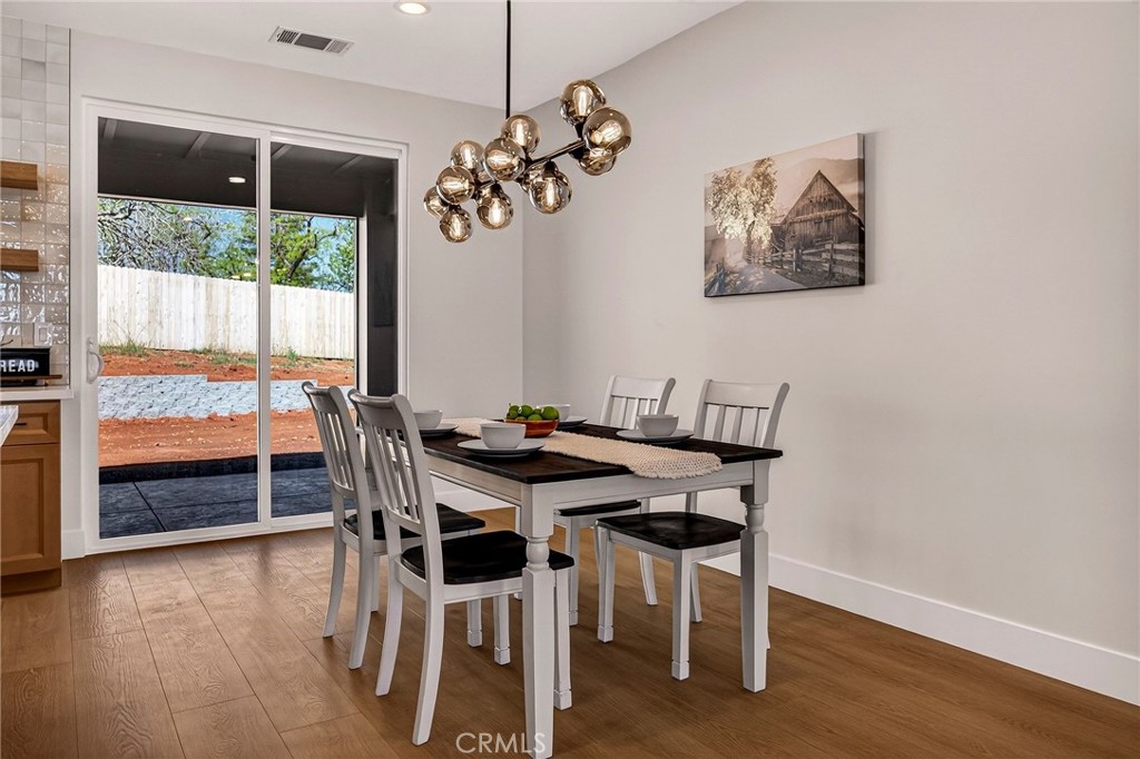1528 Forest Paradise, CA 95969 - Photo 20 of 49 a view of a dining room with furniture window and wooden floor