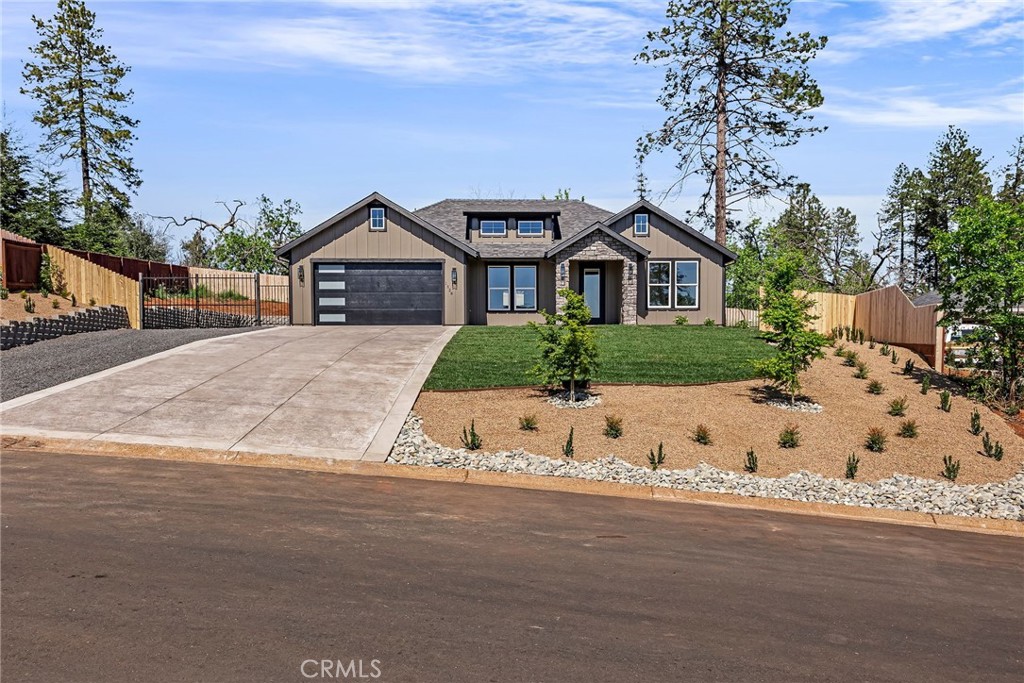 1528 Forest Paradise, CA 95969 - Photo 2 of 49 a front view of a house with a yard and garage