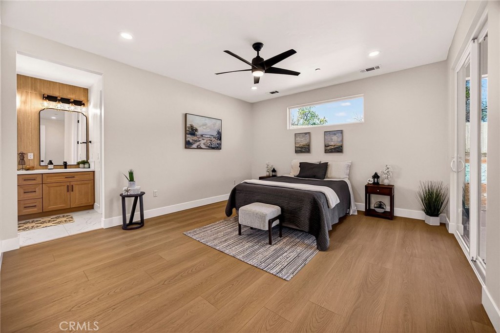 1528 Forest Paradise, CA 95969 - Photo 21 of 49 a bedroom with a bed and a chandelier