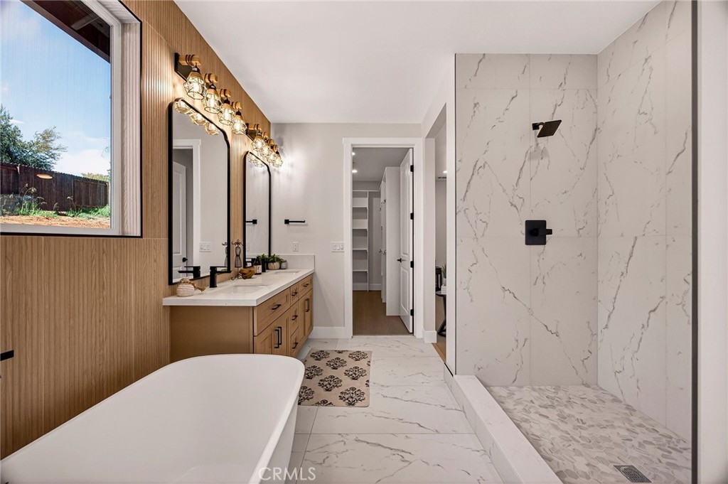 1528 Forest Paradise, CA 95969 - Photo 25 of 49 a spacious bathroom with a bathtub shower sink and mirror