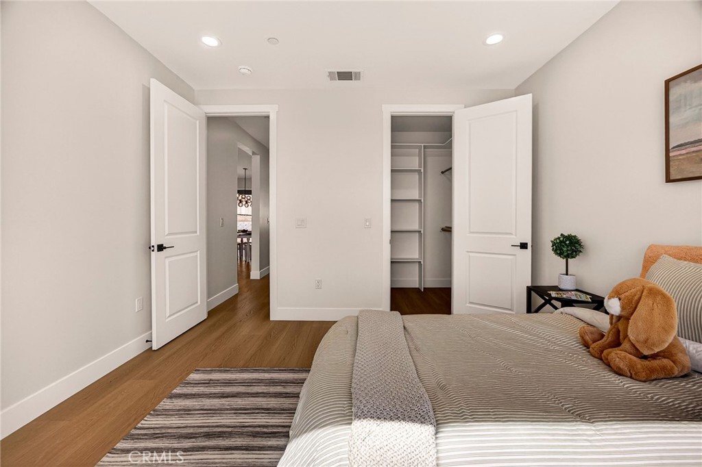 1528 Forest Paradise, CA 95969 - Photo 28 of 49 a bedroom with a bed and wooden floor