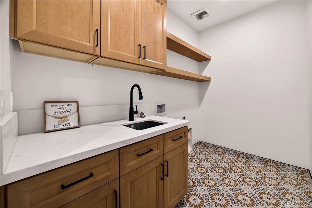 1528 Forest Paradise, CA 95969 - Photo 34 of 49 a kitchen with a sink and cabinets