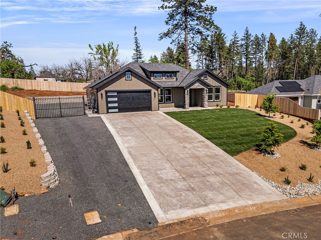 1528 Forest Paradise, CA 95969 - Photo 41 of 49 a front view of a house with a yard and garage