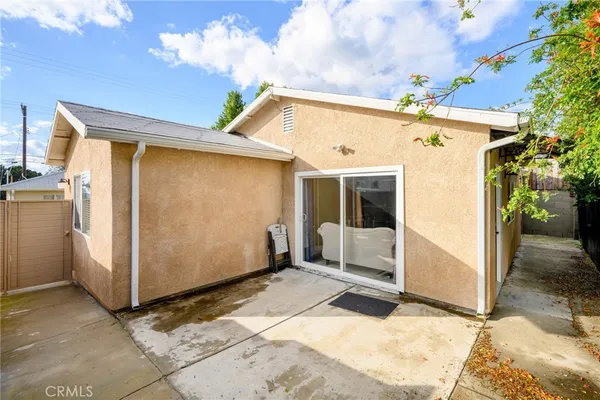 a view of a white house with a outdoor space