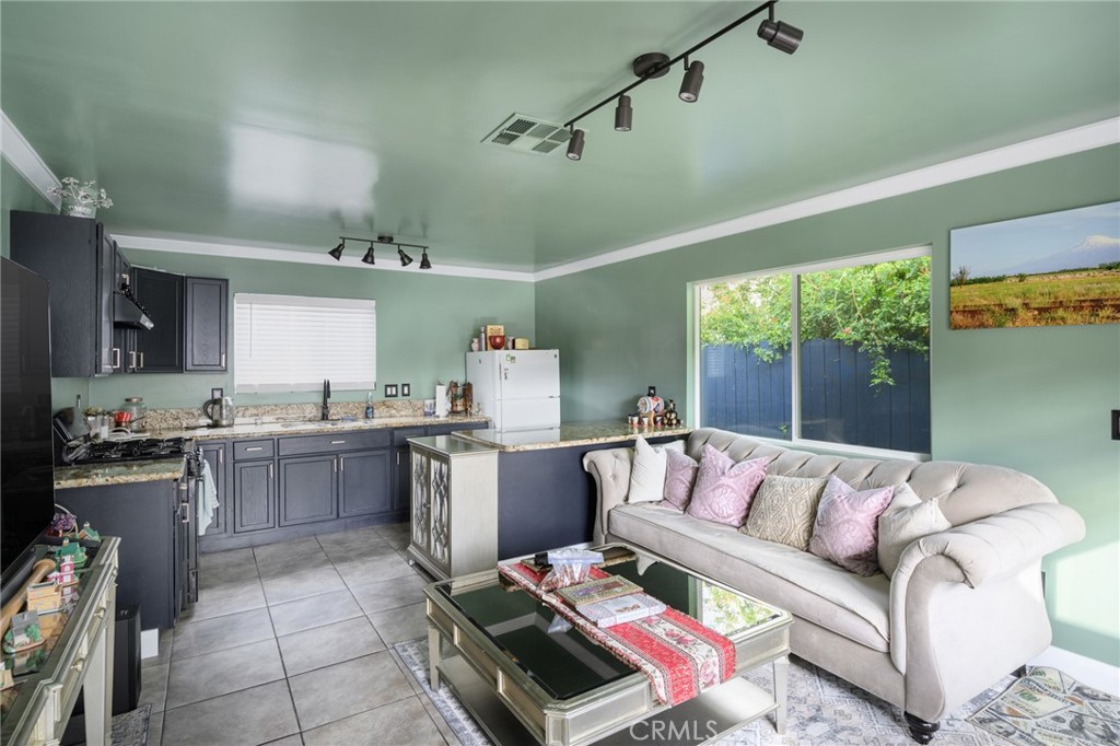 10604 Plainview Avenue Tujunga, CA 91042 - Photo 4 of 14 a living room with furniture and a large window