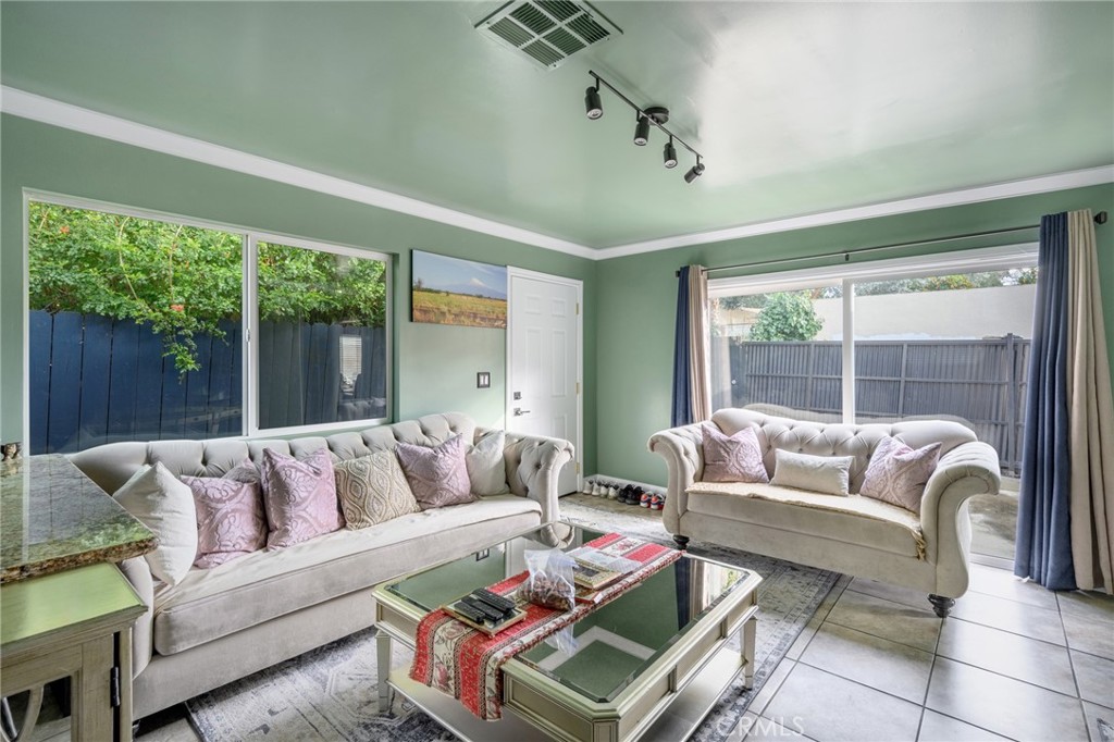 10604 Plainview Avenue Tujunga, CA 91042 - Photo 5 of 14 a living room with furniture and a large window
