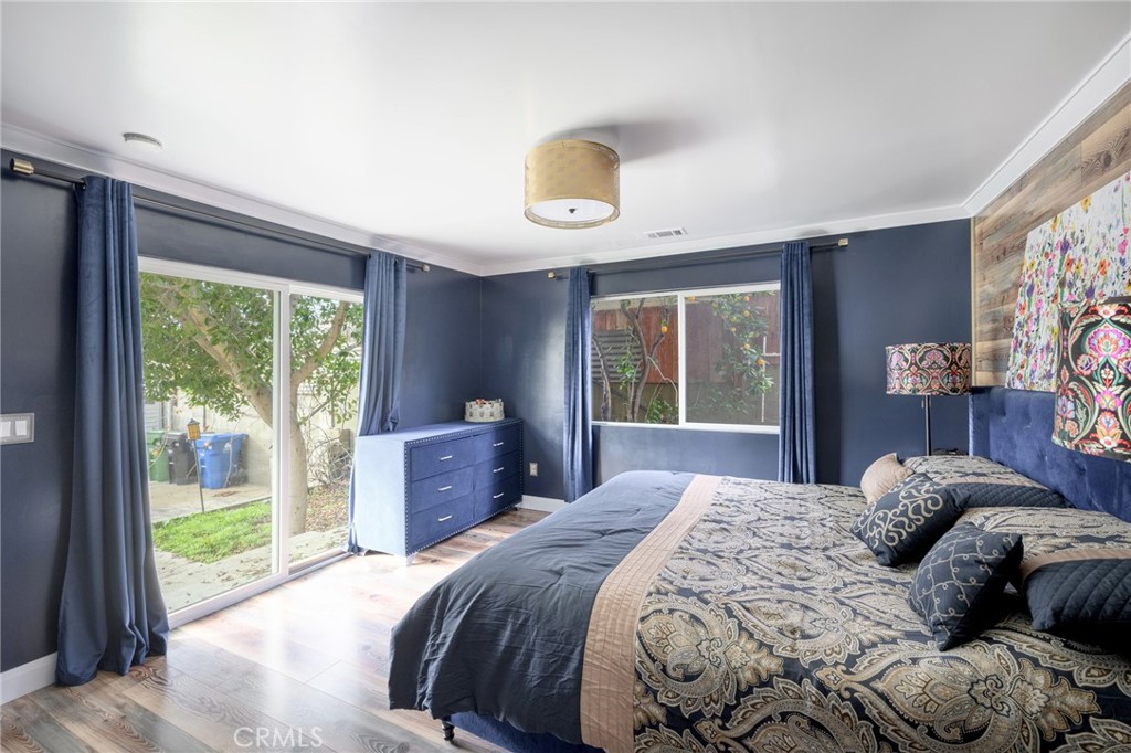 10604 Plainview Avenue Tujunga, CA 91042 - Photo 8 of 14 a bedroom with a bed and a window