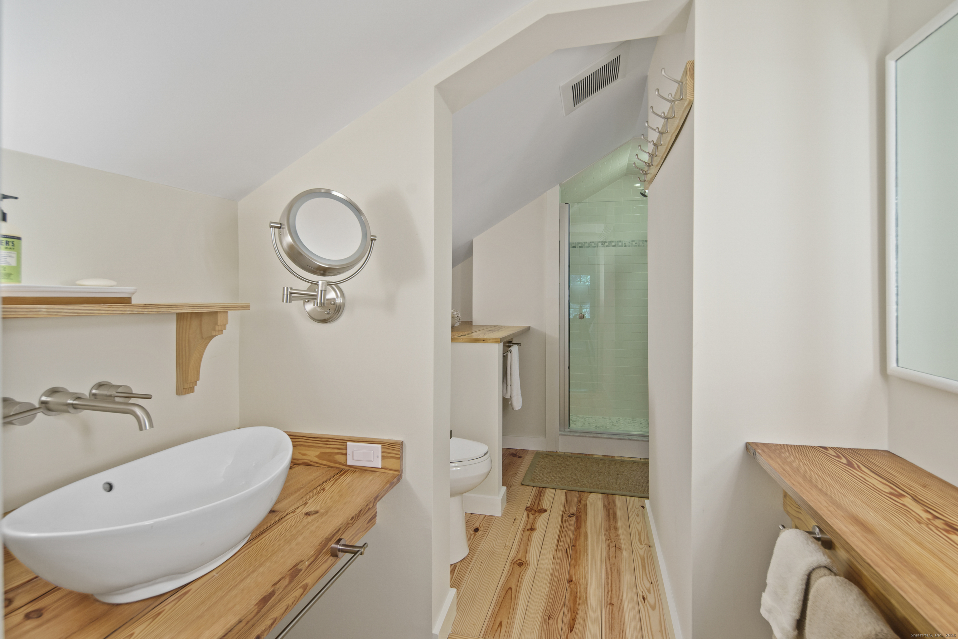 58 Kent Road Wilton, CT 06897 - Photo 14 of 19 a bathroom with a sink and a mirror