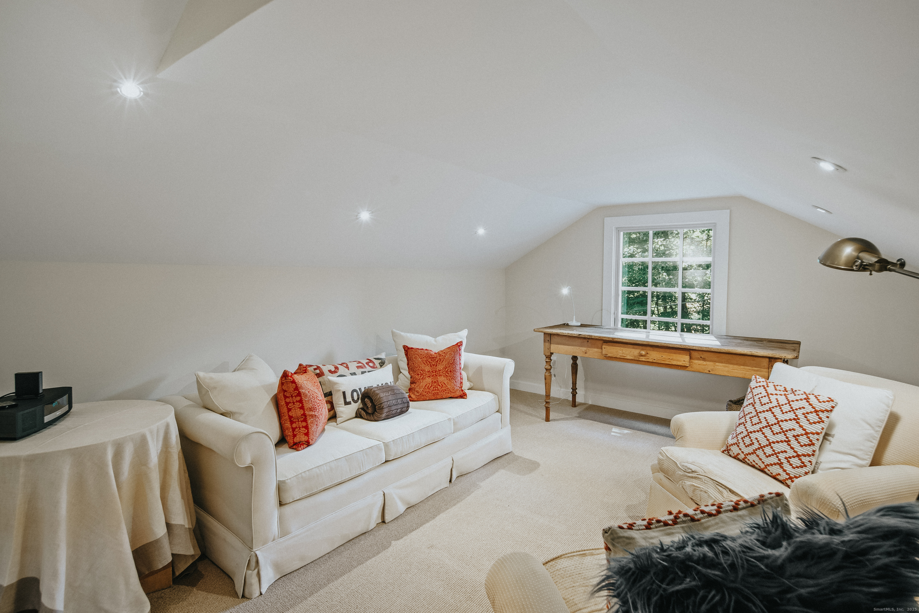 58 Kent Road Wilton, CT 06897 - Photo 15 of 19 a living room with furniture and a window