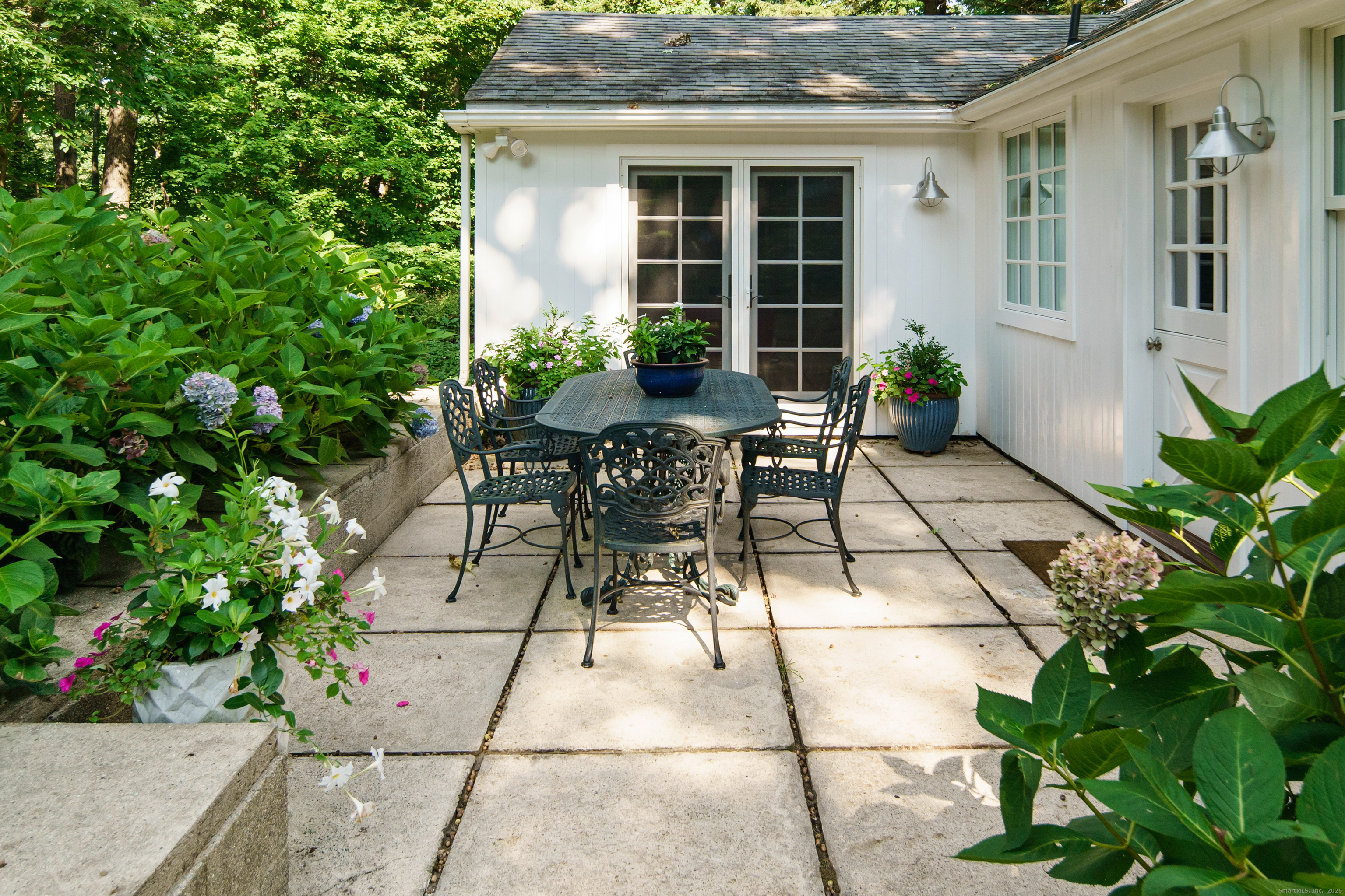 58 Kent Road Wilton, CT 06897 - Photo 17 of 19 a view of house with backyard and outdoor seating