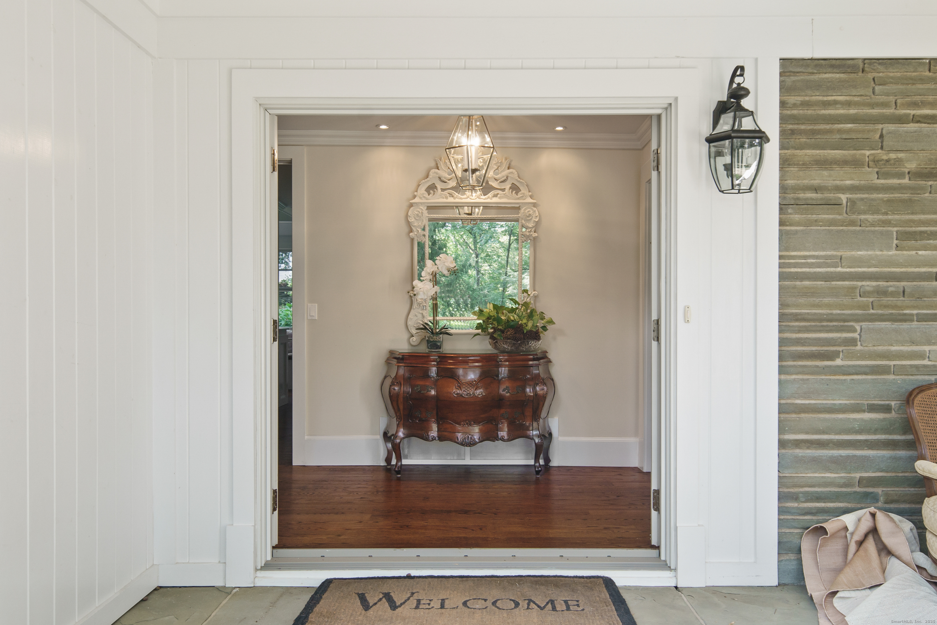 58 Kent Road Wilton, CT 06897 - Photo 2 of 19 a view of a living room with furniture and a chandelier